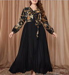 Long-sleeved chain-patterned top with pleated black skirt for a beautiful evening dress
