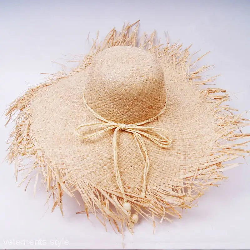 Frayed straw sun hat with ribbon bow; Beige Wide-Brim Sun Hat with Decoration Rose Red