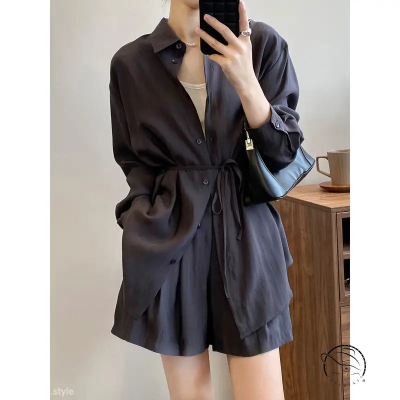 Black button-up sun protection shirt dress with waist tie