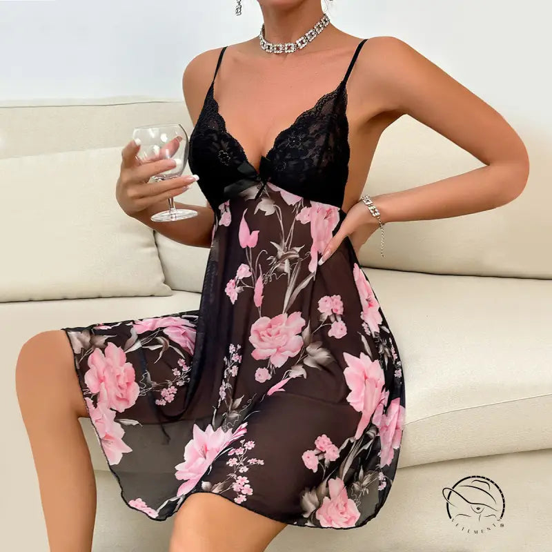 Floral print babydoll dress with black lace bodice and spaghetti straps.