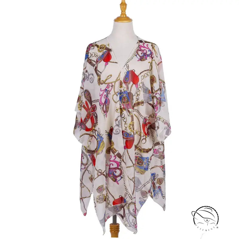 Colorful patterned chiffon swimsuit blouse on mannequin