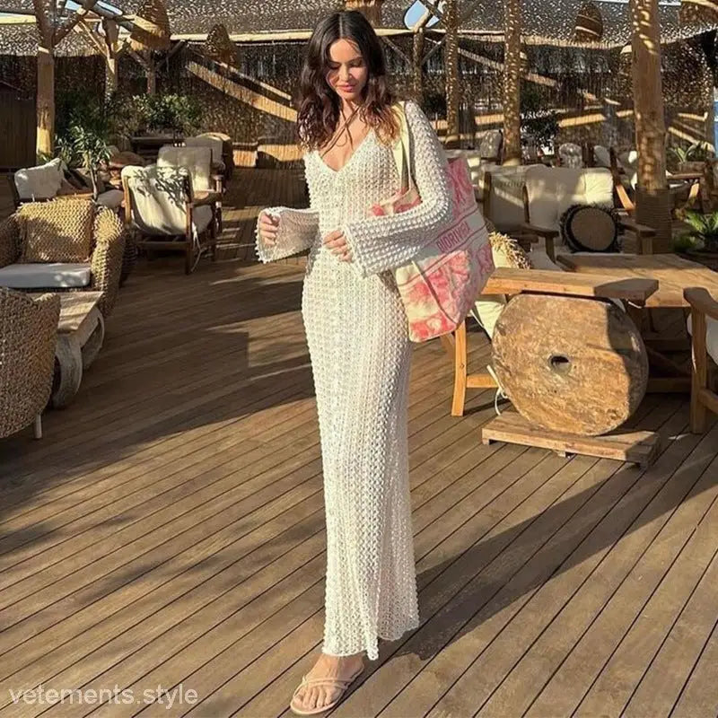 Long white crocheted dress ideal for summer beach vacations and stylish bikini swimsuit blouses
