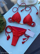 Red braid rope bikini featuring braided string ties and tassels in a stylish design