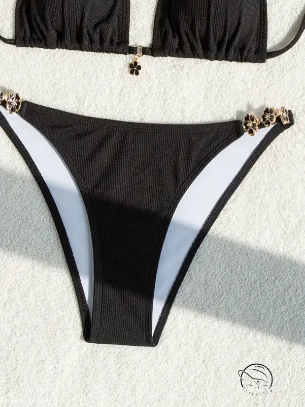 Black bikini bottom with gold clover charms on halter strap adjustable swimsuit