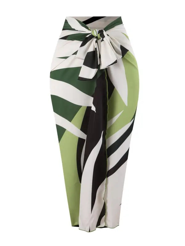 Green, white, and black patterned sarong paired with a Boho Summer Color Block Jumpsuit