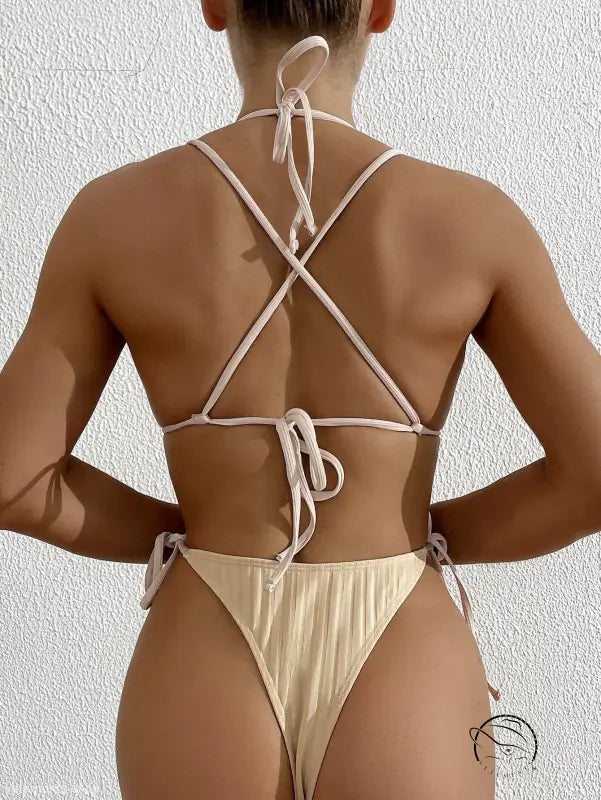 Woman in beige bikini-style one-piece swimsuit from Boho Summers, free shipping