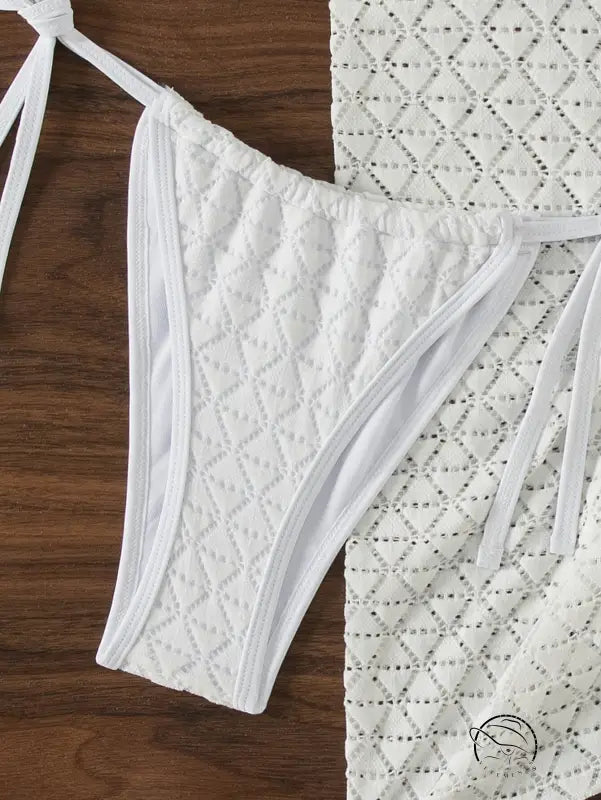 White three piece bikini bottom with quilted diamond pattern and tie sides