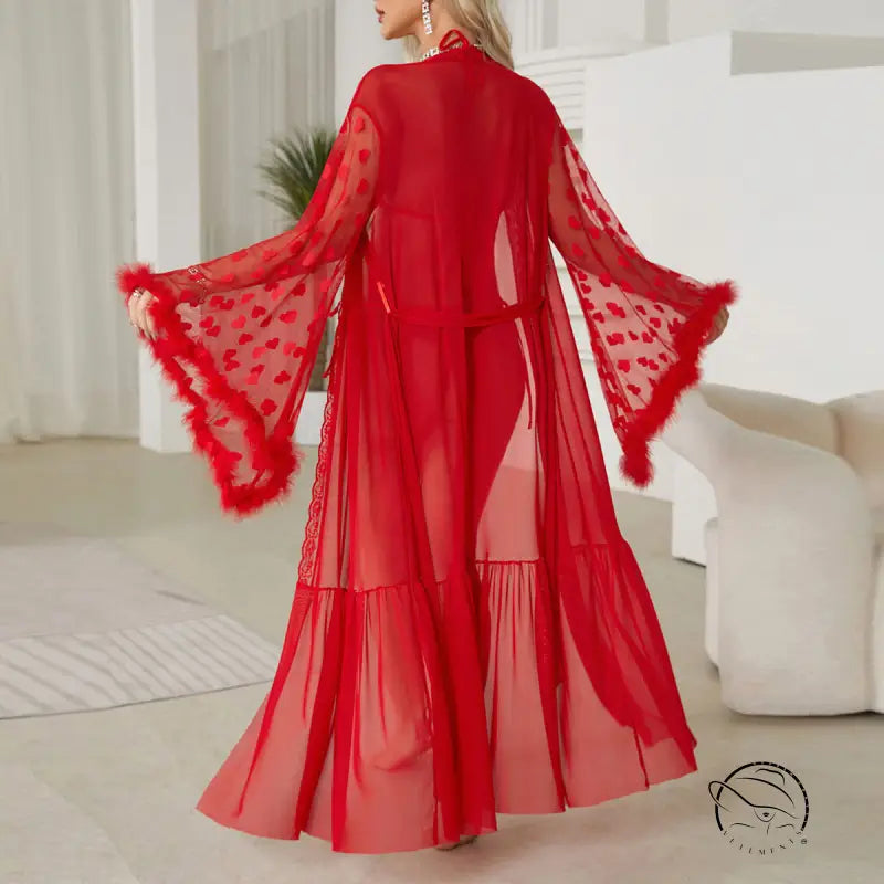 Red sheer robe with flared sleeves and feathered trim.