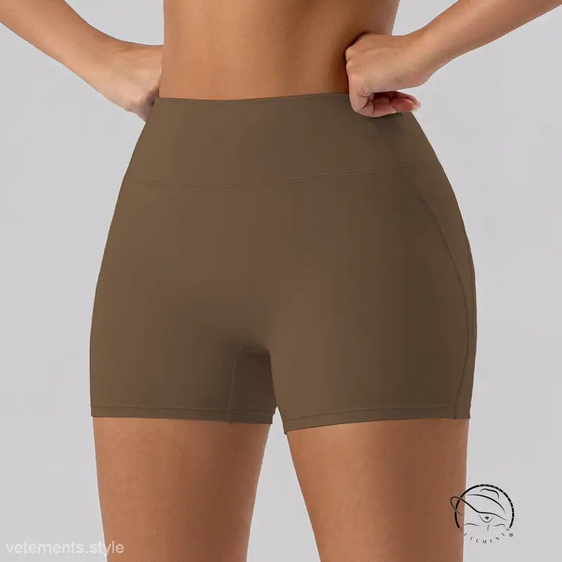 Burnt tea brown close fitting yoga shorts in sporty slim nylon