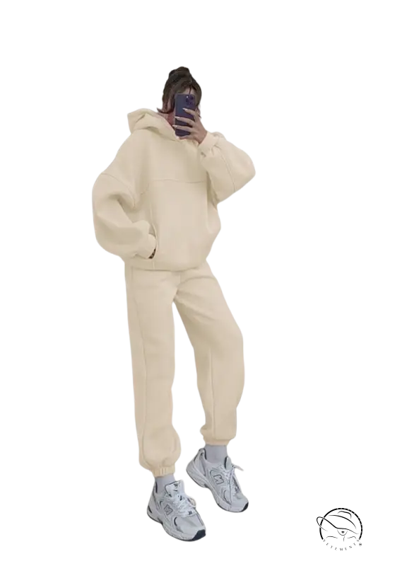 Person in casual comfy sweaters two piece winter solid color set taking mirror selfie