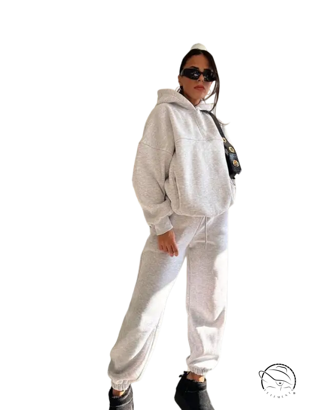 Woman in casual comfy sweaters two piece winter solid color set with sunglasses