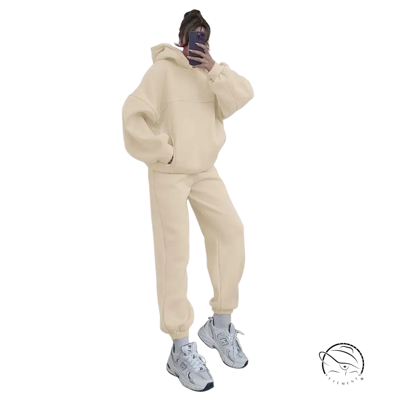 Person in casual comfy sweaters two piece winter solid color set taking mirror selfie