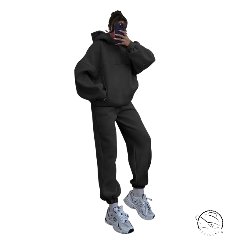 Person in casual comfy sweaters two piece winter solid color set taking mirror selfie