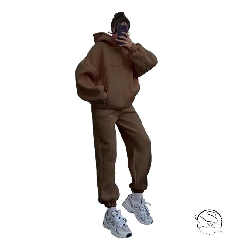 Person in casual comfy sweaters two-piece set taking mirror selfie