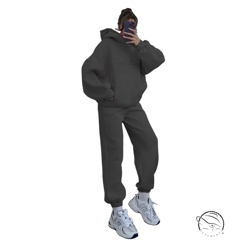 Person in casual comfy sweaters two-piece set taking mirror selfie