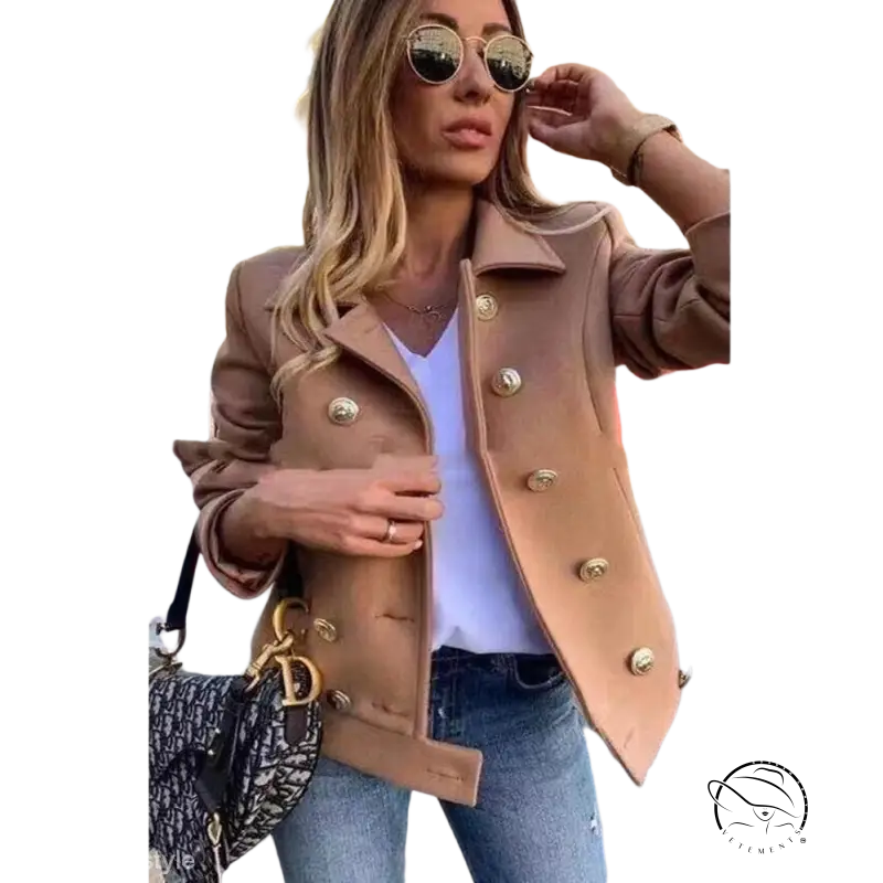 Stylish beige double breasted jacket with gold buttons and loose fit over white top and jeans