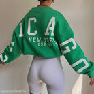 Green knitted graphic printed hoodie featuring white lettering for casual wear
