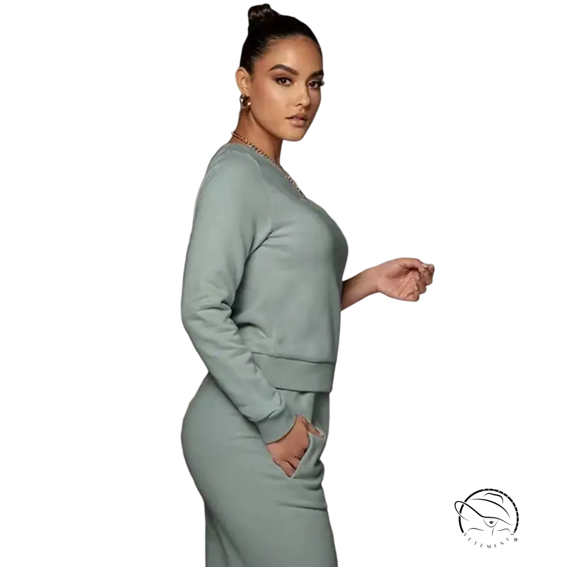 Sleek light mint green off-shoulder sweater set with full-length trousers