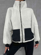 White and black urban knitted jacket with high collar, ideal for autumn winter comfort
