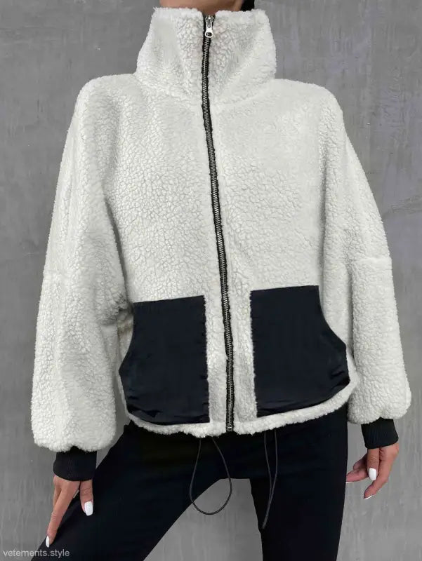 White and black urban knitted jacket with high collar, ideal for autumn winter comfort