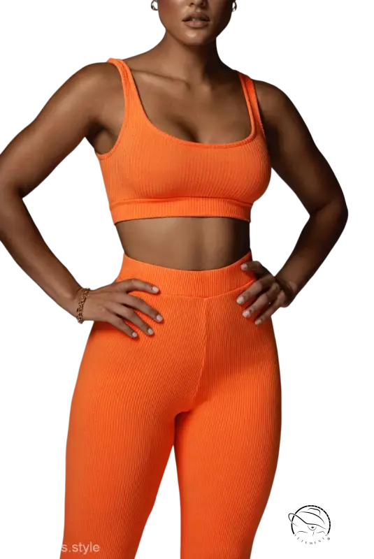 Vibrant orange casual yoga set with ribbed cropped sleeveless top and skinny yoga pants