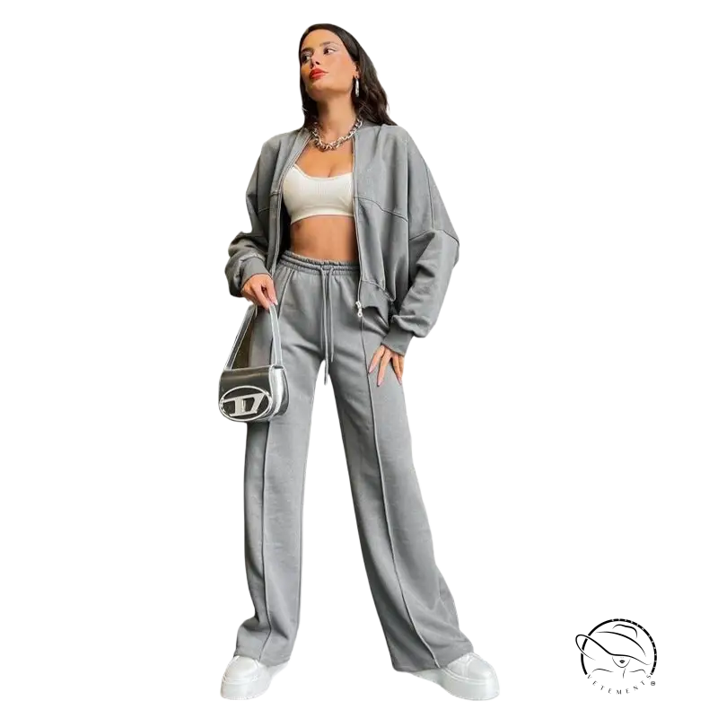 Woman in gray zipper cardigan sweater set with casual straight pants