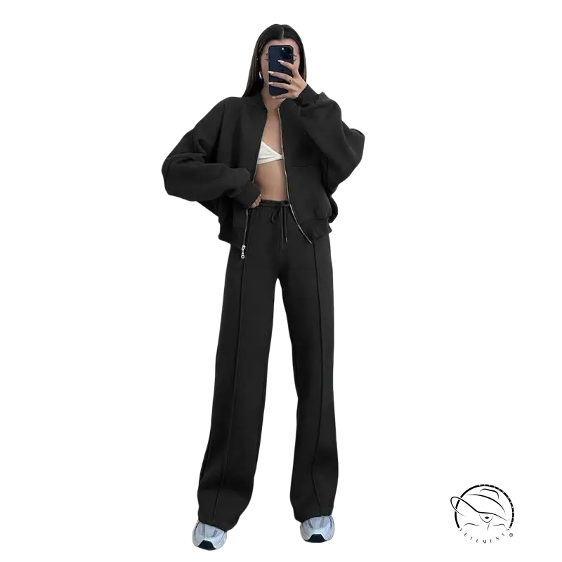 Woman in black zipper cardigan sweater set with casual straight pants