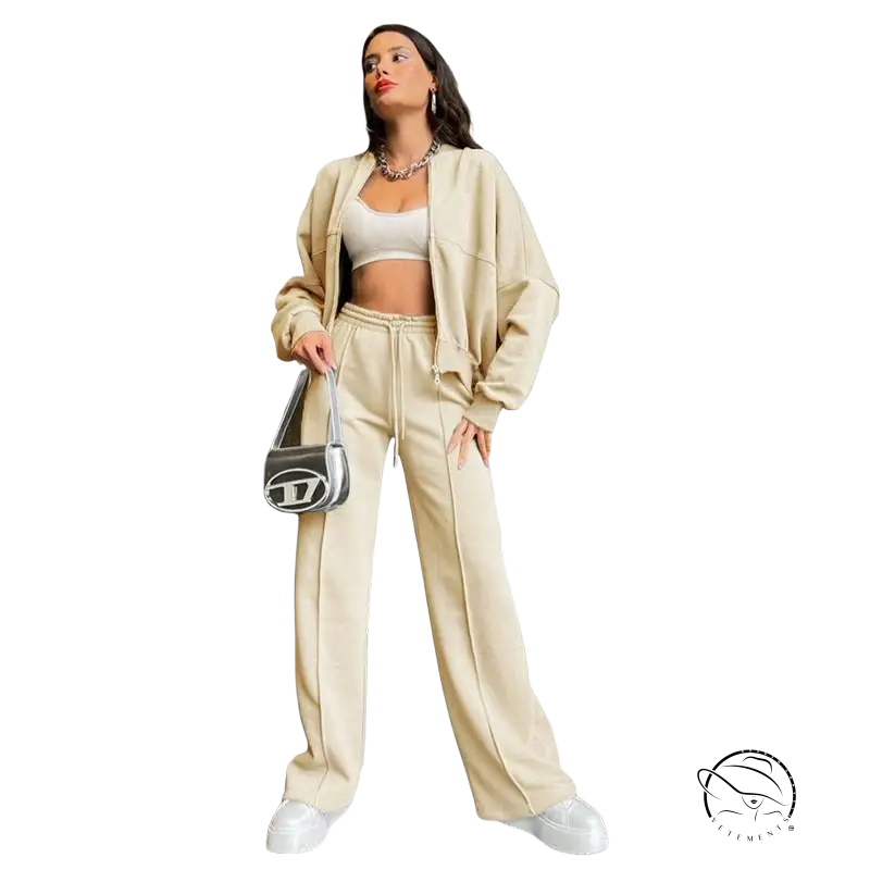 Woman in beige zipper cardigan sweater set with casual straight pants and handbag