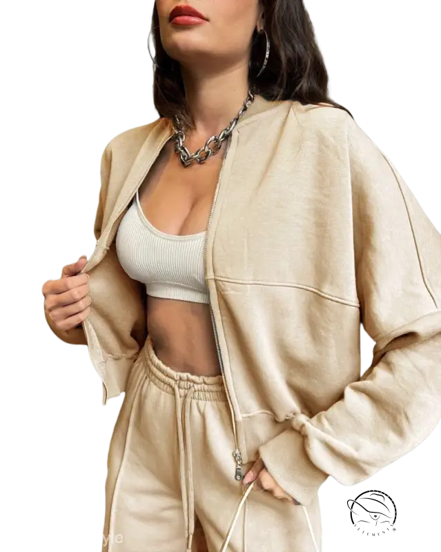 Beige zipper cardigan sweater set with silver chain and casual straight pants