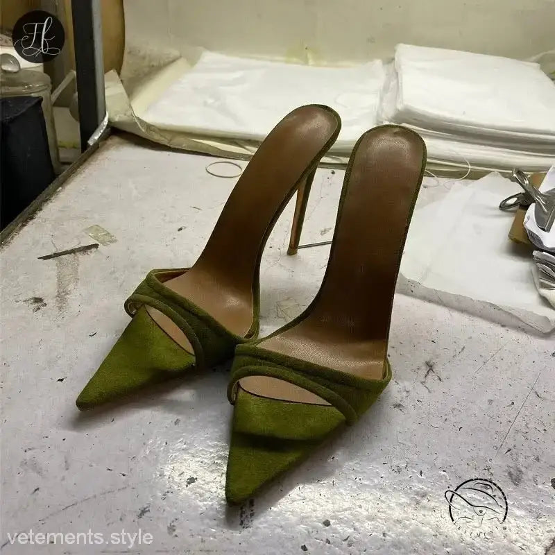 Pair of green pointed-toe chic summer slide stiletto pumps with thin straps