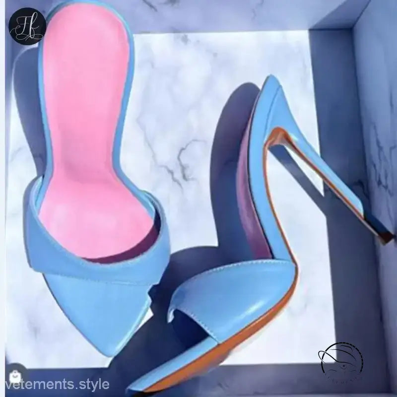 Pair of light blue stiletto pumps with pink insoles, chic summer slide style