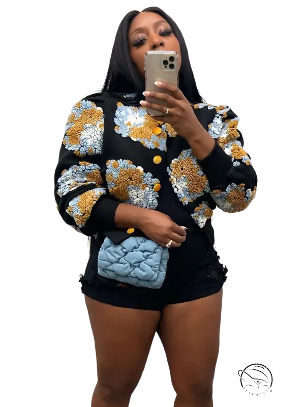 Rose red Chrysanthemum floral print jacket with blue quilted leather purse on black background