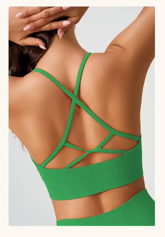 Green ribbed sports bra with strappy back for comfy high waist yoga shorts in peach blossom pink and dark coffee color