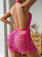 Bright pink fringed mini dress with open back and cat tattoo, ideal for summer parties