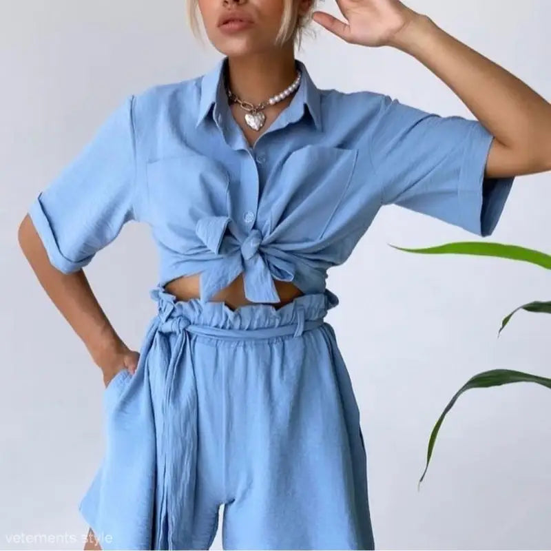 Light blue cute casual beach set featuring a tied crop top and high-waisted pants