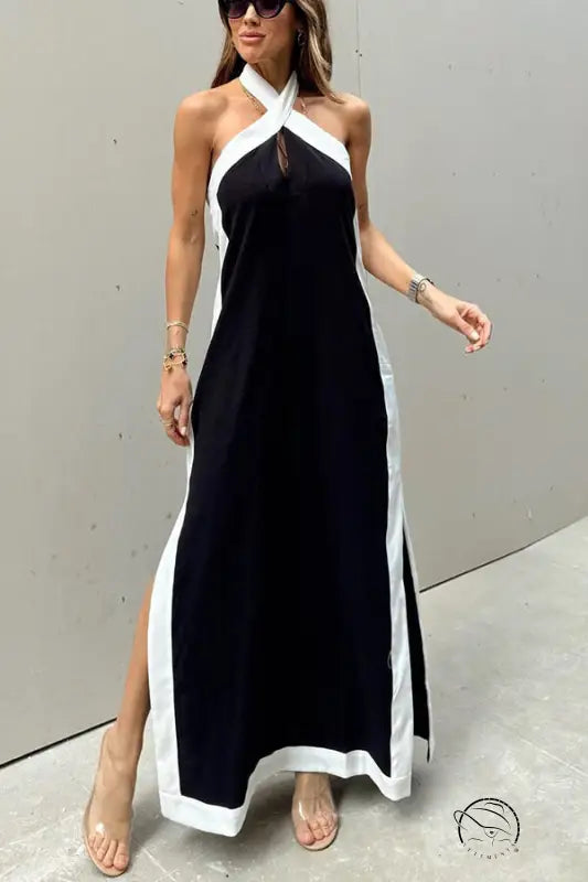 Black and white halter-neck maxi dress with side slits.