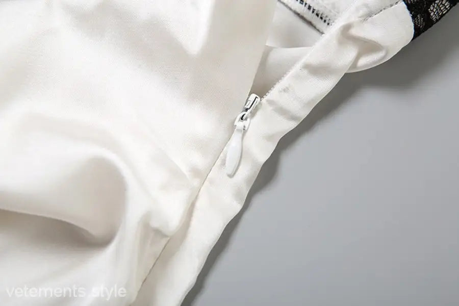 Elegant Backless Lace Split Dress featuring a white satin garment with zipper detail