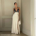 Elegant backless lace split dress featuring a white gown with black lace bodice