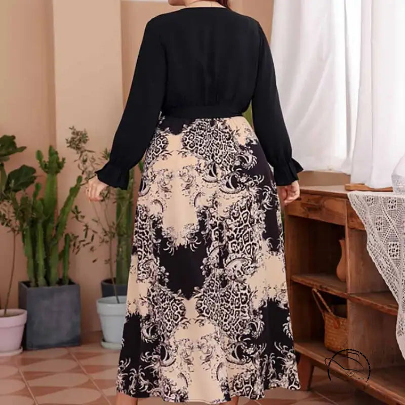 Elegant belted V-neck maxi dress with black top and floral skirt