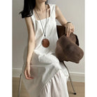White sleeveless maxi hem stitching dress with ruffled hem and pocket detail