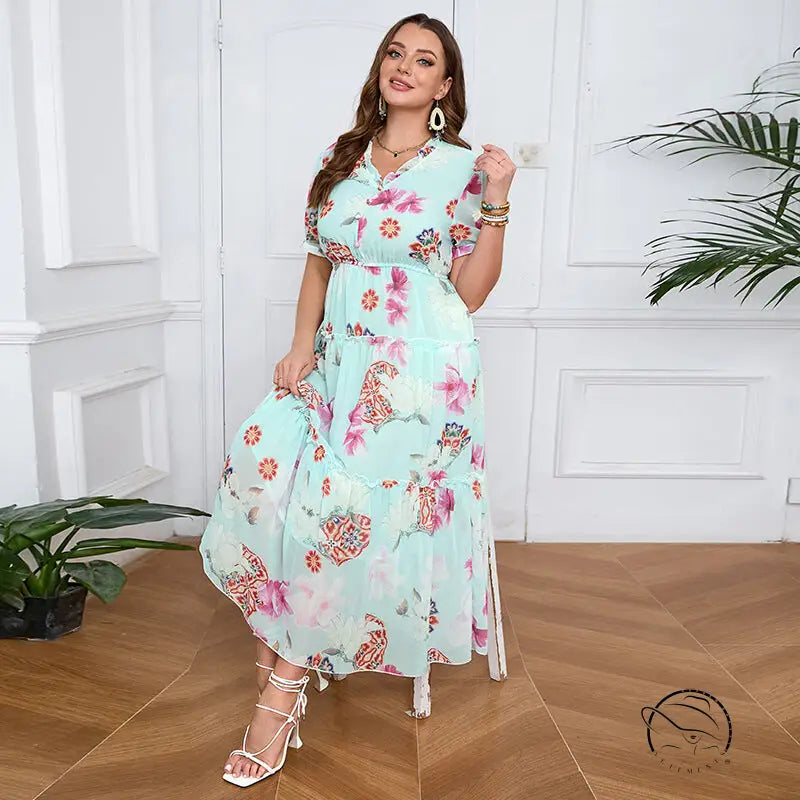 Elegant evening maxi dress in light green floral with ruffles