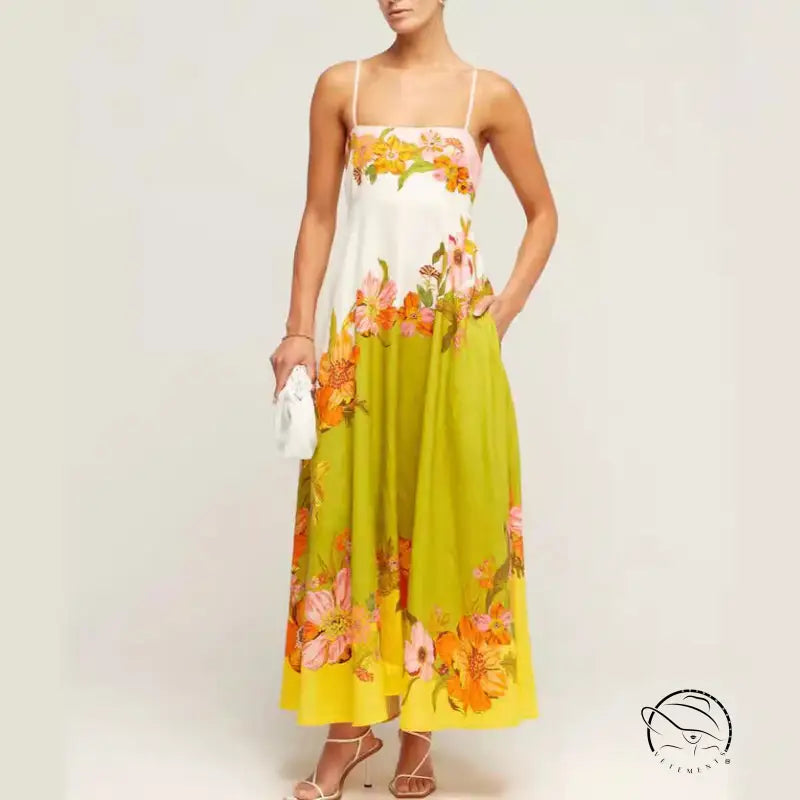 Floral print maxi dress with spaghetti straps and a white bodice transitioning to a lime green and yellow skirt.