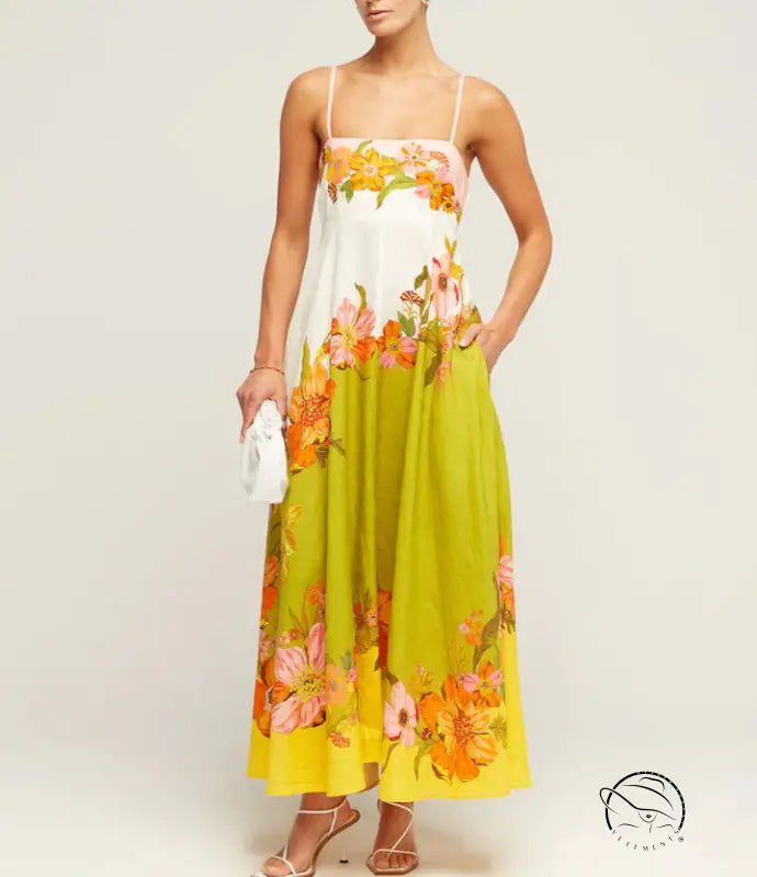 Floral maxi dress with spaghetti straps in white, lime green, and orange tones.