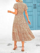 Floral print bubble pleated dress with short sleeves and cinched waist for elegance