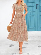 Floral print midi dress with short sleeves and tiered skirt, a stylish bubble pleated dress