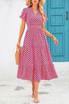 Pink and white floral bubble pleated dress with short sleeves and v-neckline