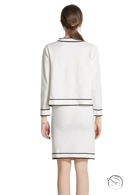 Elegant high rise long sleeve top with short skirt set in white with black trim