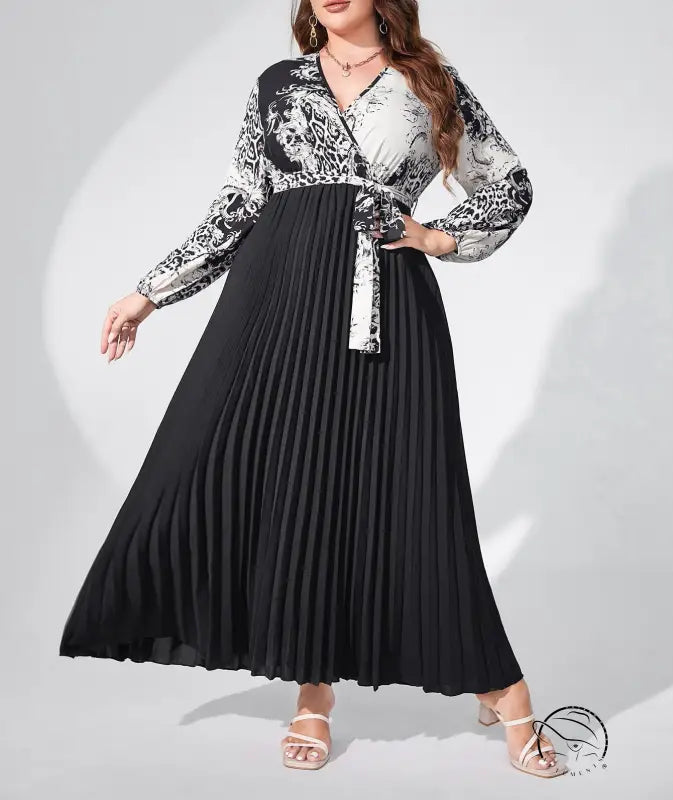 Elegant high waist maxi dress with belted V-neck, lantern sleeves, black pleated skirt, and patterned top