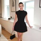 Elegant high waist short dress with pockets, perfect for summer wear in a sleek black design