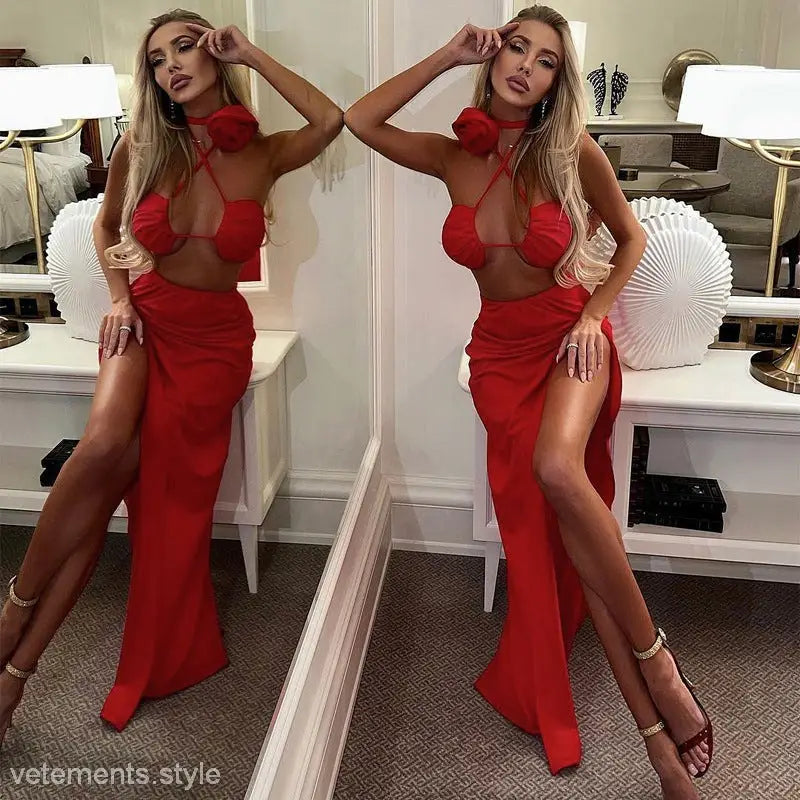 Woman in red two-piece dress showcasing elegant floral decorative lace and lace wrapped chest